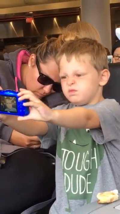 This kid taking selfies at LAX in 2017.