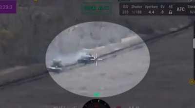 Russian Tank hit by an ATGM causing the crew to flee.