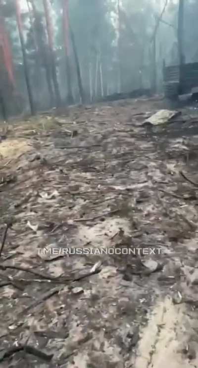 A russian soldier films the remains of his units equipment after a ukrainian strike [said to be from 