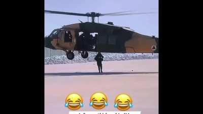 Taliban dismounting from a helicopter.