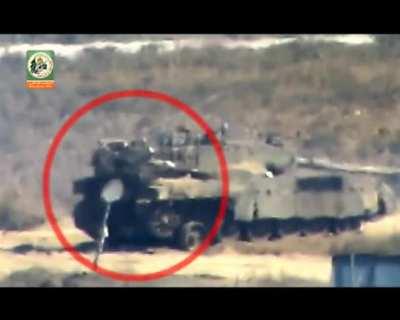 a qassam brigades kornet ATGM hitting an israeli merkava east of shujayyah during the 2014 gaza war