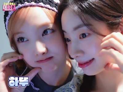 Nayeon and Dahyun taking pictures together