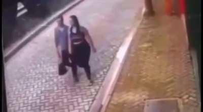 This couple dodging a car.