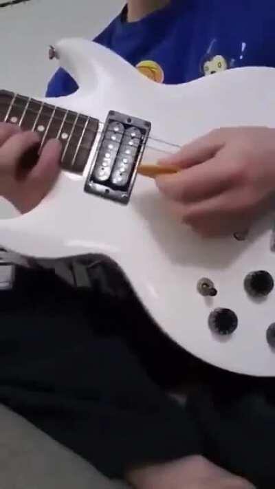 to play a guitar with a biscuit