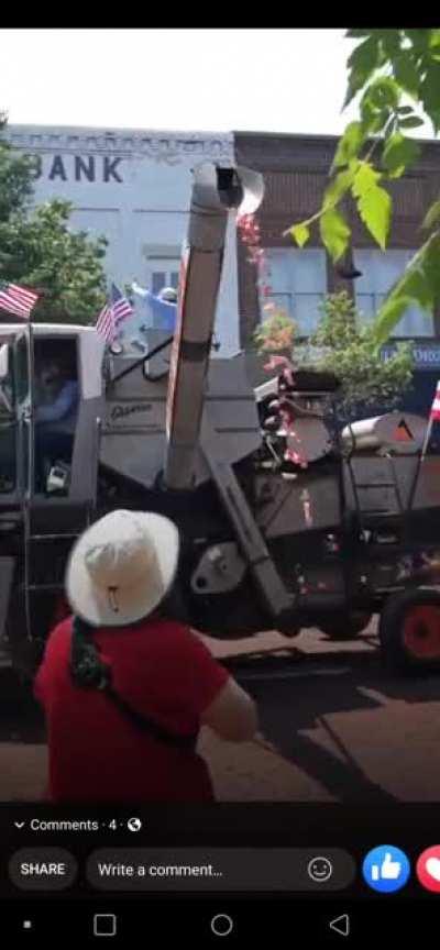 We converted an old combine to dispense candy through the unload auger in parades. Happy 4th of July!