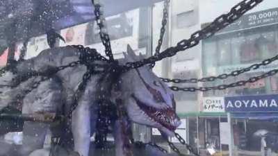 On the streets of Tokyo, they noticed a transport with a monster in a transparent cage. As it turned out, this is an advertisement for the film 