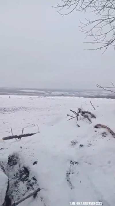 Ukrainian servicemen based in a dugout record their comrades moving forward through Bakhmut's 'no man's land' recently. A Ukrainian T-64 Tank opens fire first blasting a 125mm shell followed by a BRDM-2 which unleashes 14.5mm KPVT heavy machine gun rounds