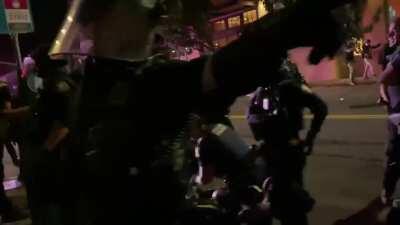 Another video from the protests in Portland, Or last night. It shows Portland police officers running after a civilian before tackling them and repeatedly punching them in the face while the man screams 