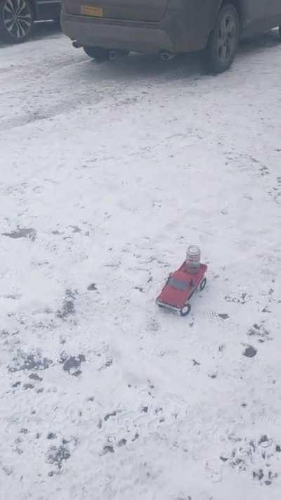 When you're in the parking lot at a ski area and a fellow dude sends a beer on an RC truck.