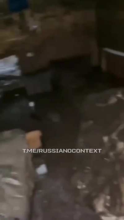 A russian invader worked hard building a dugout, but it flooded again