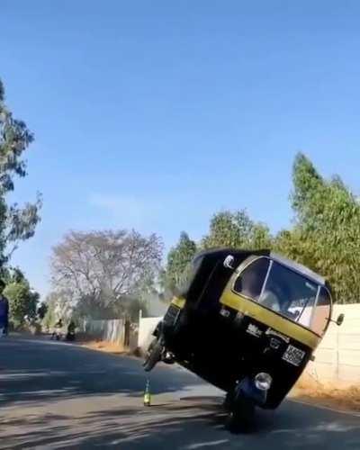 This dude balances his rickshaw on a glass bottle