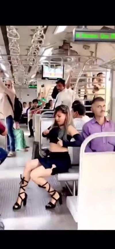 Girl thinks the train is her studio...also the purple shirt  guy