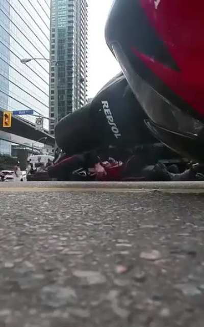 Officer forcibly bends biker's hand backward, breaking it during 