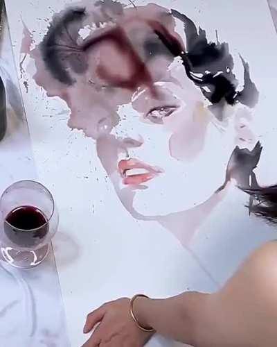 Girl makes art using wine spills