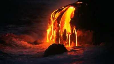 Mesmerizing lava dripping into the ocean