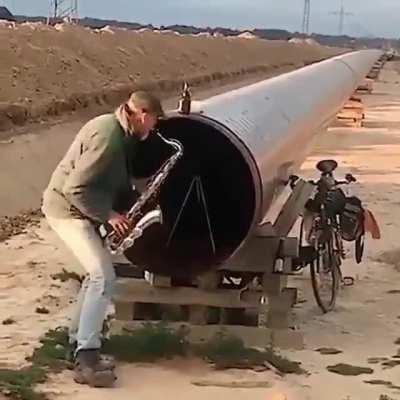 Just A Guy, Playing A Sax, Outside A Giant Pipe