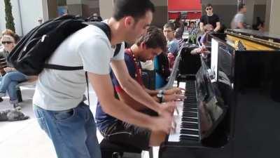 Guy shows up by a piano and starts improvising with a stranger