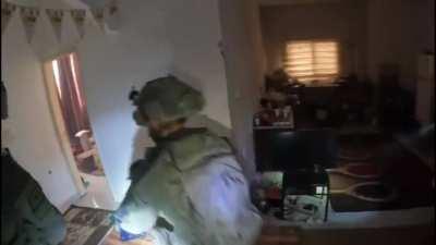 IDF soldiers clearing rooms take fire from 2 Hamas combatants hiding in a room