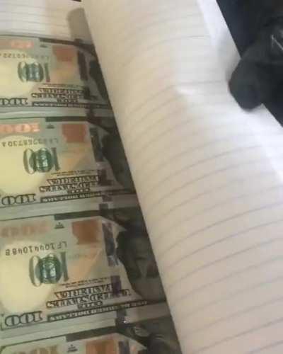 Federal agents discovered a book with counterfeit currency, but only after flipping though it in the opposite direction