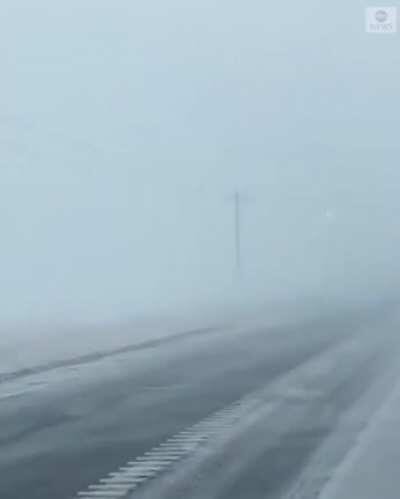 Power lines arcing during a blizzard.