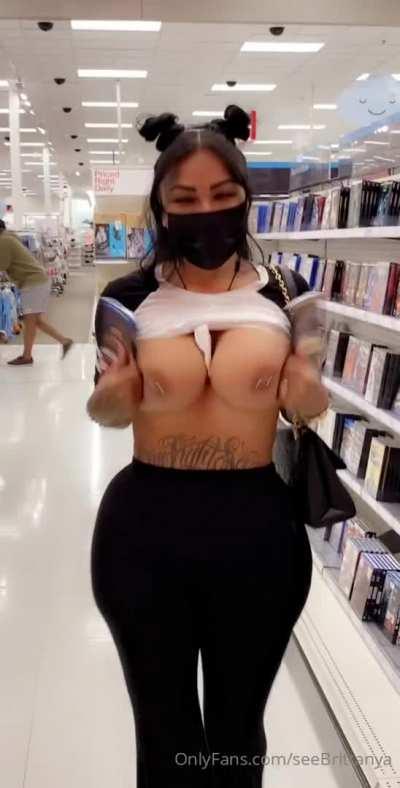 Flashing her big titties in public