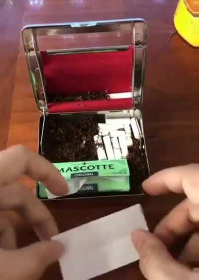 A cigarette rolling case