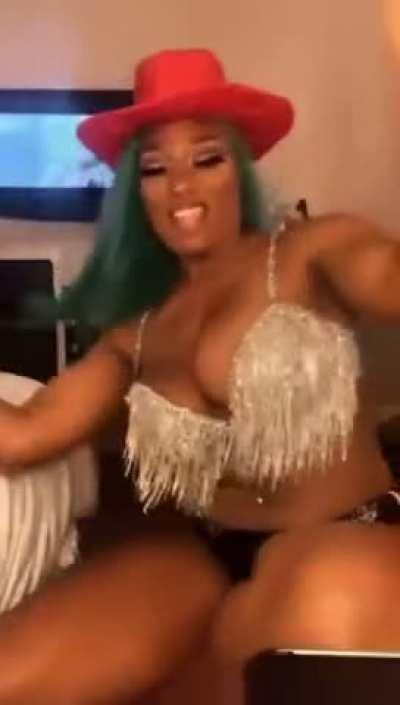 Megan Thee Stallion riding an imaginary cock