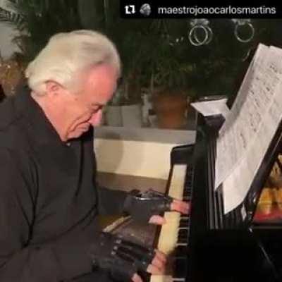 Wholesome moment: Brazilian maestro João Carlos Martins uses bionic gloves to play the piano after 22 years. He's lost movement of his fingers after two accidents and 24 surgeries.