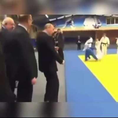 Kid learns a new move from Putin.