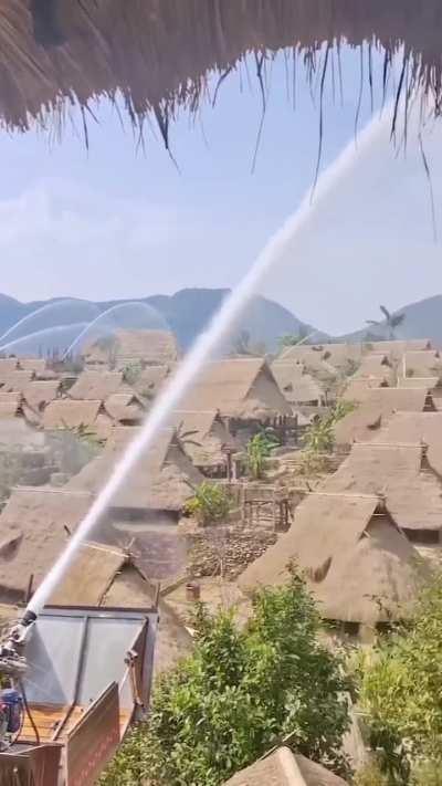 Water guns protecting buildings from fires in Wengding Village, Yunnan, China.