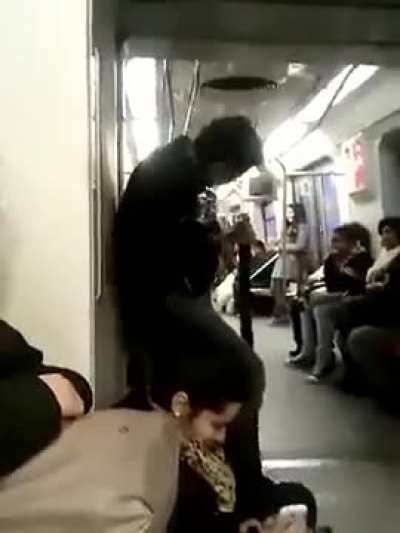 Crazy guy plays guitar on train