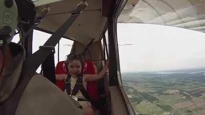 Four-year-old laughs uncontrollably on her first aerobatic plane ride with pilot Dad