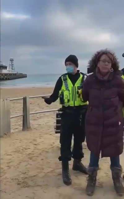 Two arrested at beach for : sitting on a bench and being out twice in a day