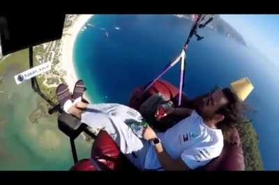 Man attempts to paraglide with couch