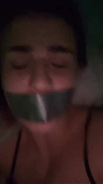 My mouth gagged with tape, I try to talk dirty 