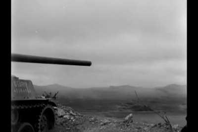 M18 Hellcat tank destroyer with the Anti-tank Company of the 306th Infantry Regiment attacking Japanese fortified positions at Shuri on Okinawa in mid 1945