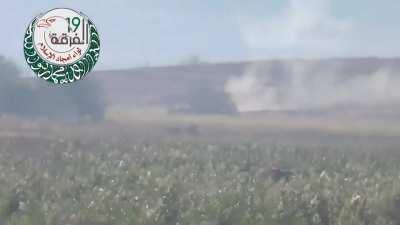 At least one crewman bails after a Syrian Army tank is engaged by an opposition ATGM team - 2014