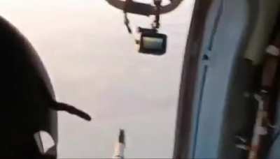 Ukrainian helicopter door gunner shoots down Shahed drone.