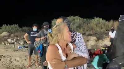 Women attacking Native Americans protesting border wall in California.