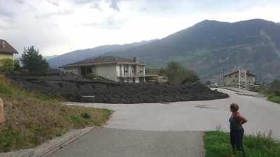 Hazardous mudslide falls down a mountainside