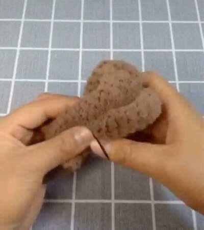 Teddy bear made from a single piece of cloth