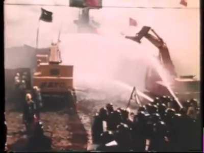 Battle between protestors in a giant wooden fortress and riot police during the Sanrizuka Struggle (Japan, 1971)