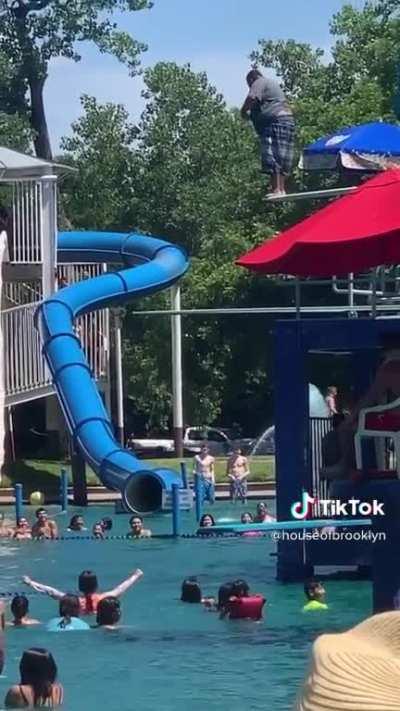 Guy at a water park scared to jump gets encouraging cheers by others