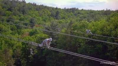 Faraday suit worn by linemen during high voltage power line inspection