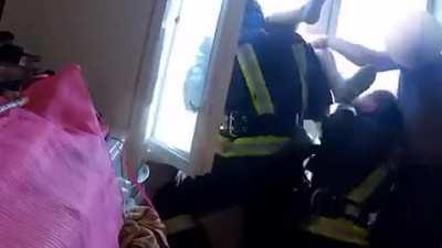 Firefighter snatches suicide jumper out of mid air