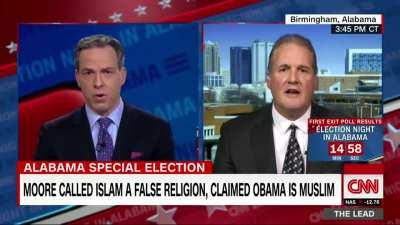 Jake Tapper fact checks Ted Crockett, a spokesman for Judge Roy Moore's campaign, about lawmakers having to swear on the Bible, and leaves Ted speechless.