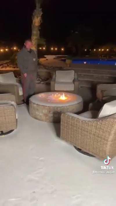 lighting a fire pit in snow