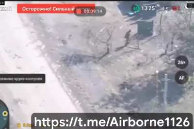 Drone footage of two Russian soldiers trying to defuse a Ukrainian IED.