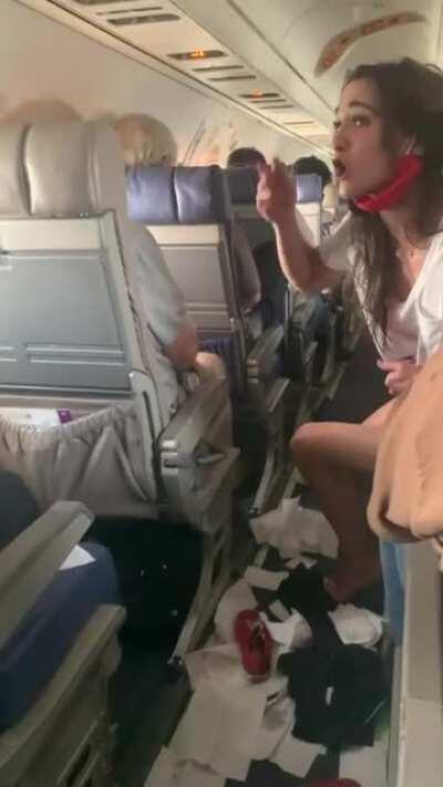 White American air passenger (Sierra Nicole McClinton, 25) on a Jacksonville-Houston United Express flight forces plane to be diverted to Alabama; got drunk, threw up on herself prompting her to take off her pants, spit on another passenger; had to be det