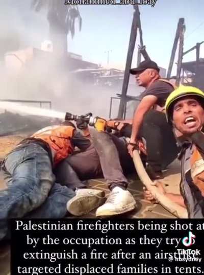 Palestinian firefighters being shot at by the IDF while they trying to put down tent fires after Israeli airstrikes.